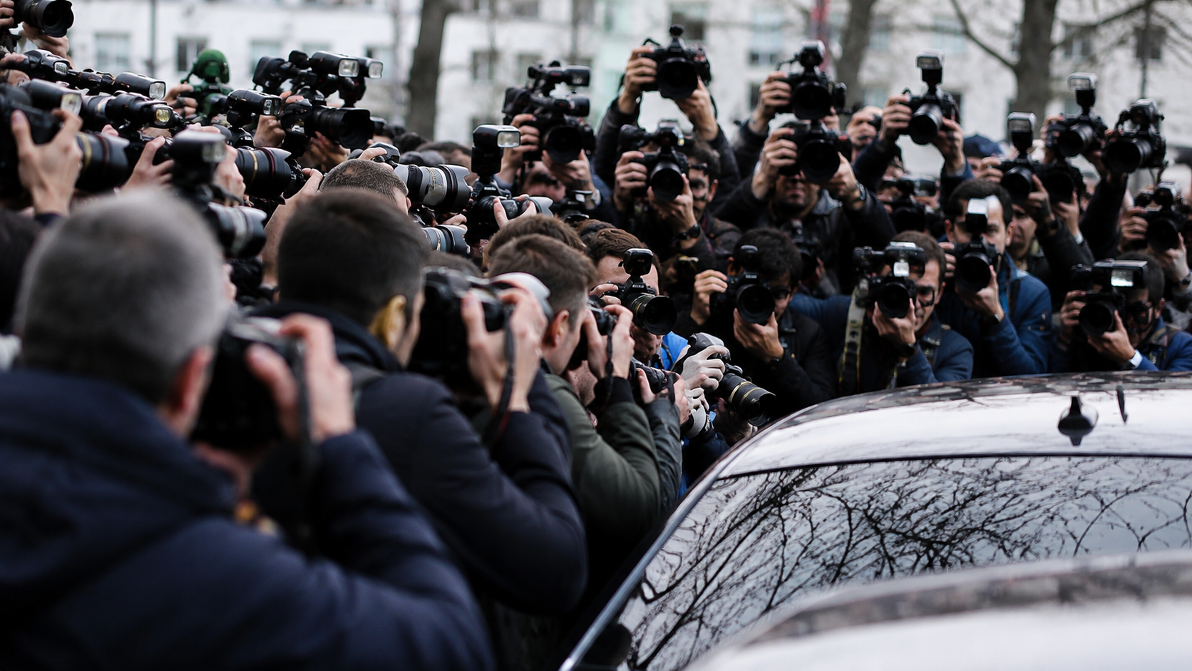 an image of paparazzi taking picture